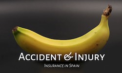 A complete banana on a black background promoting accident and injury insurance 